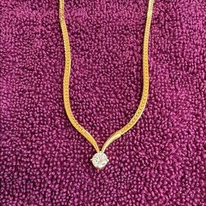 Elegant Gold toned Necklace with Solitaire Crystal Pendant